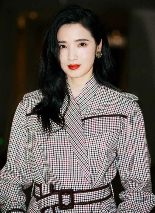 Beibi Gong portrait in plaid outfit